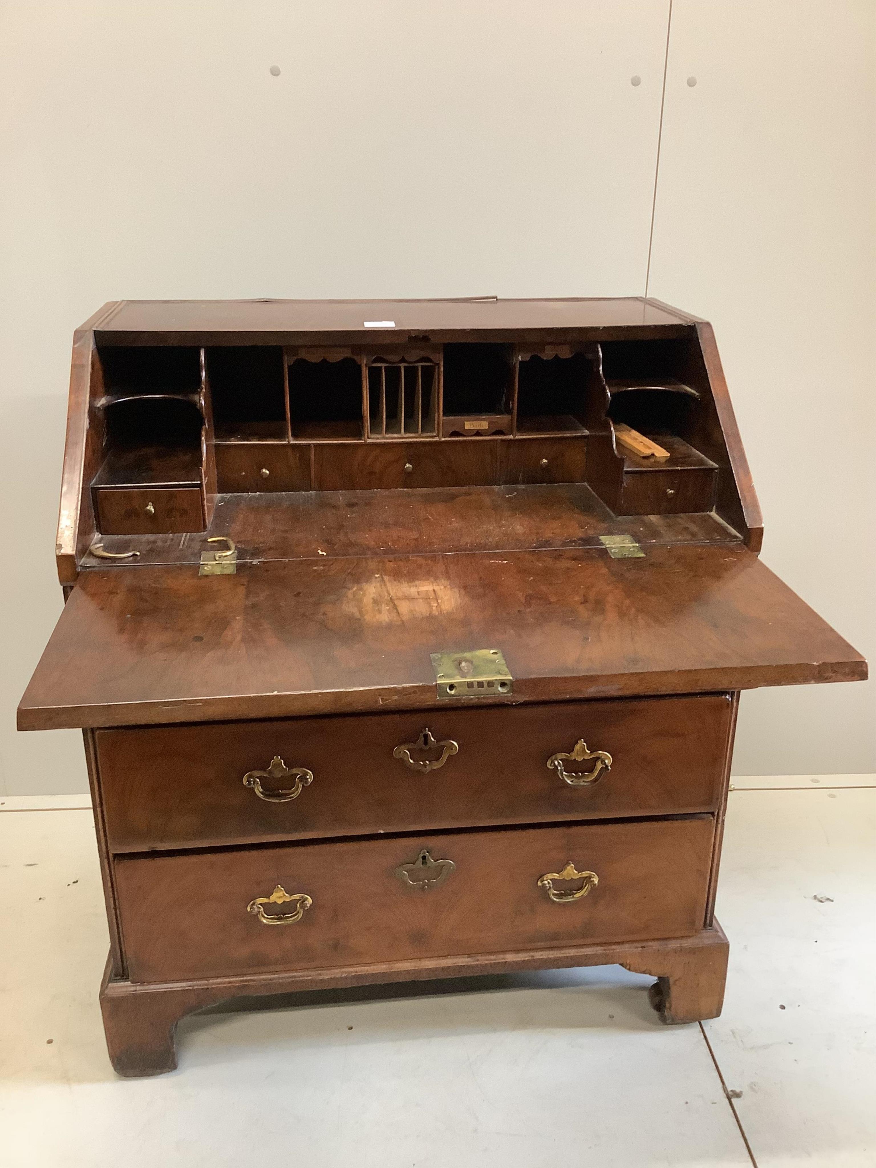An 18th century feather banded walnut bureau, width 84cm, depth 51cm, height 101cm. Condition - poor